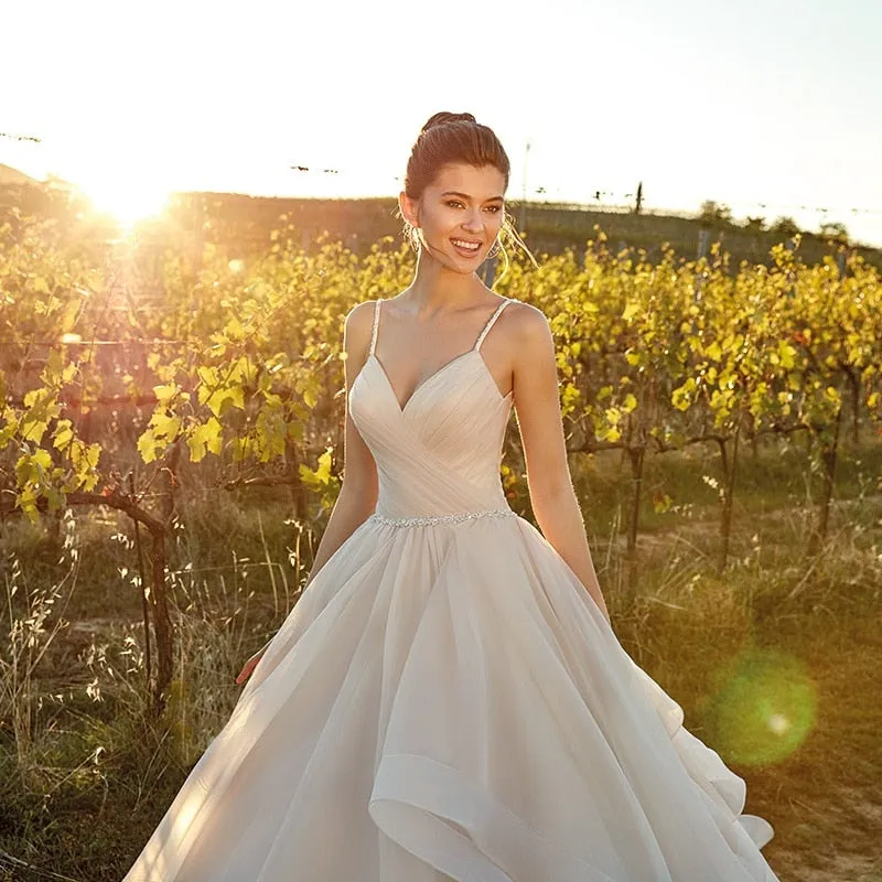 Spaghetti Straps And Tiered Ruffles Flowing Sweep Train Are The Feature Of This Beautiful Dress