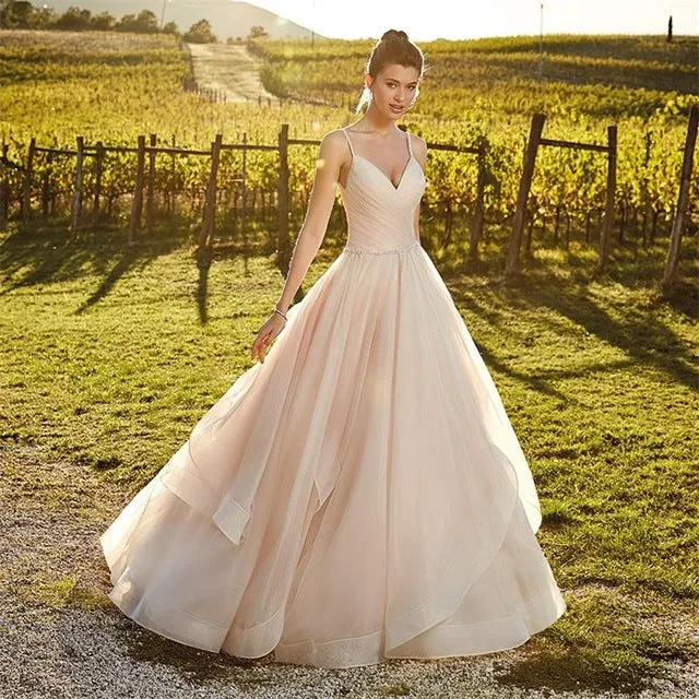 Spaghetti Straps And Tiered Ruffles Flowing Sweep Train Are The Feature Of This Beautiful Dress