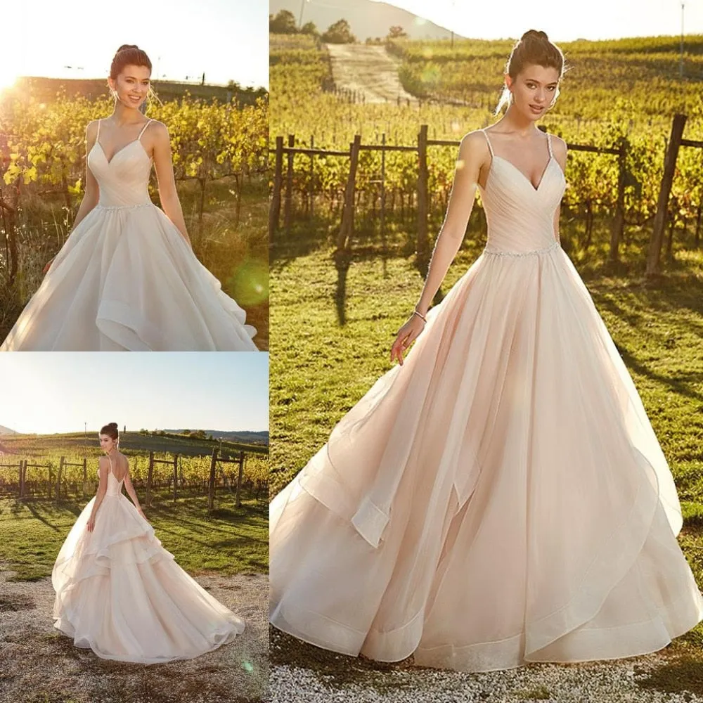 Spaghetti Straps And Tiered Ruffles Flowing Sweep Train Are The Feature Of This Beautiful Dress