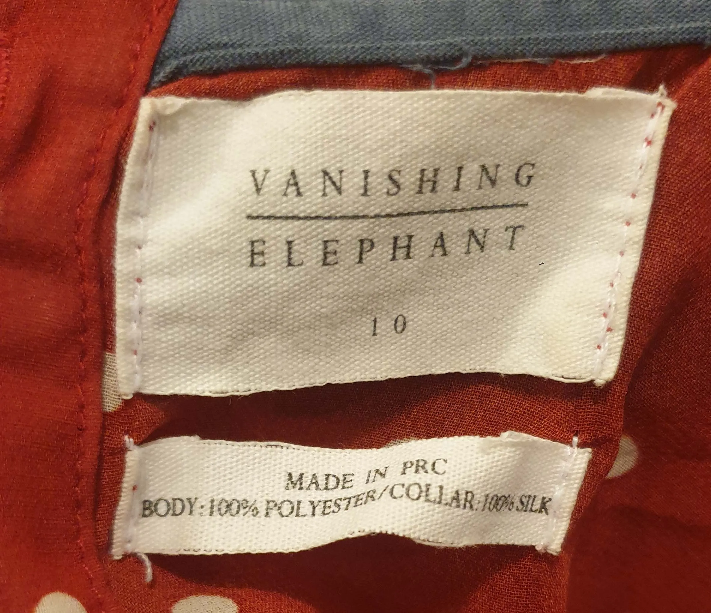 Vanishing Elephant red polka dot top with blue peter pan collar size S
